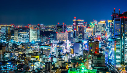 Fototapeta na wymiar Asia business concept for real estate and corporate construction - panoramic urban city skyline aerial view under twilight sky and neon night with highway junction in hamamatsucho, tokyo, Japan