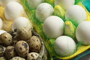 White chicken Chicken and quail eggs in colored paper eco-friendly packaging with  sisal Close-up photo Easter background 