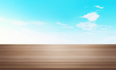 Design concept - Empty dark wood table top with dramatic cloudy sky background for display or montage product