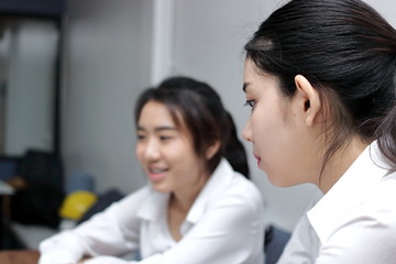 Envious young Asian business woman conflict with her colleague in office. Crisis and confrontation business concept.