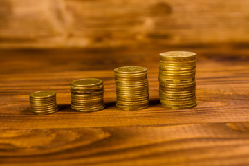 Stack of the coins on wooden table