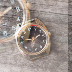 old wrist watch on a wooden background
