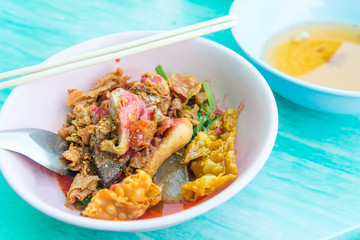Yong Tau Foo noodles is the Hakka Chinese food soup and red sauce with egg noodles, shrimp and fish meatball delicious street food of Thailand.