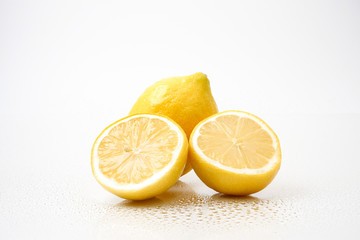 Fresh lemons on a white background