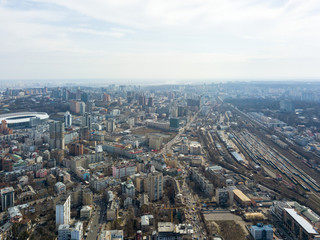 Fototapeta na wymiar The city landscape with railroad tracks and the Olympic Sports Complex. Kiev, Ukraine