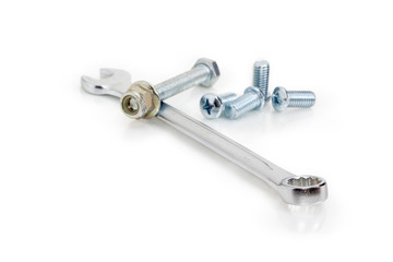 Combination wrench among of bolts, screws,  nuts at selective focus