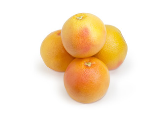 Small pile of the red grapefruits on a white background