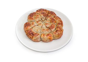 Baked homemade pork sausage curtailed by a spiral