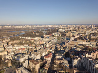 Aerial view of the city center of Kiev and Hydropark against the blue sky on a sunny day