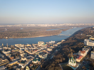 Kiev, Ukraine - April 7, 2018: Panoramic view of the Dnieper River pedestrian bridge, Trukhanov Island and Andreevskaya church .