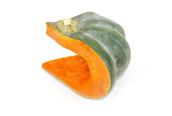 Piece of the dark green pumpkin on a white background