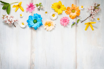 Spring summer flowers on wooden retro planks abstract floral background
