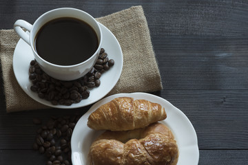 A cup of coffee and breakfast meal