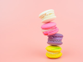colorful macaron or macaroon on pink background