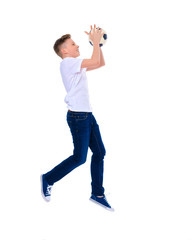 The little boy catches a soccer ball.