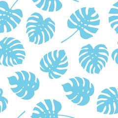 Seamless pattern of blue monstera leaves. Tropical leaves of palm tree background