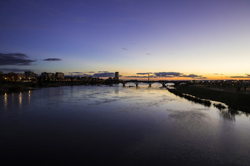Fototapeta na wymiar Badajoz, Spain. Views at sunset of river Guadiana and the Puente Real (Royal Bridge), from the Puente de Palmas bridge