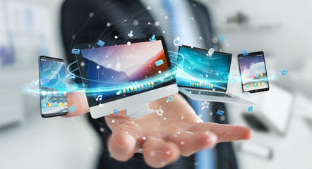 Businessman connecting tech devices and icons applications 3D rendering