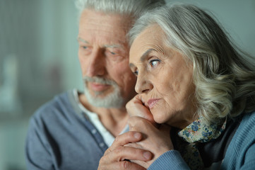Portrait of sad senior couple posing 