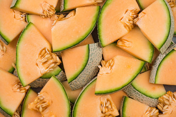 Cantaloupe melon slices, full frame food background © marcin jucha