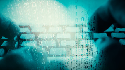 Cyber security, hacker typing on a computer keyboard