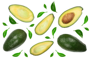 whole and half avocado decorated with green leaves isolated on white background close-up. Top view