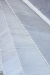 Close-up view of geometrical background of light gray marble stairs