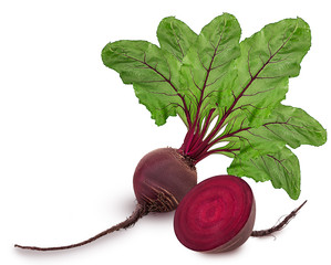 Fresh red beet root one whole and cut in half with green leaf