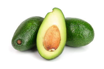 whole and half avocado isolated on white background close-up. Top view