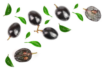 Dark grapes decorated with green leaves isolated on white background with copy space for your text, top view. Flat lay