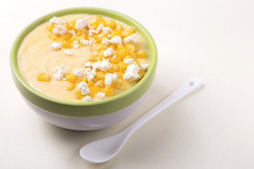 Polenta with feta. Corn porridge. Italian appetizers. Wooden background.