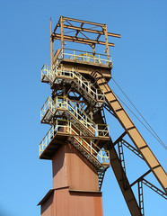 Fototapeta na wymiar Brown, traditional mine shaft tower in Poland