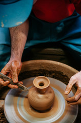 Man making pottery art, clay work close up hands shot