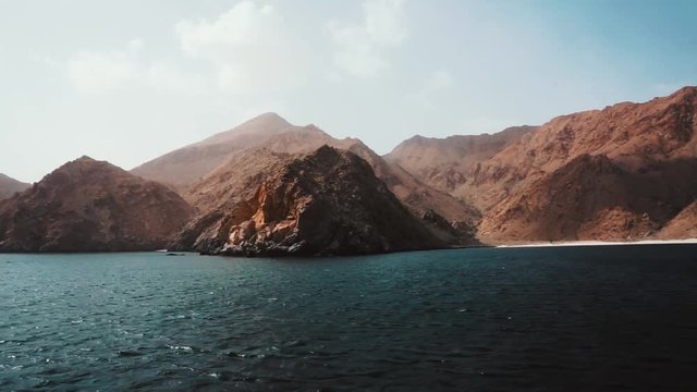 Ship travel sails along Musandam peninsula, Sultanate of Oman, Gulf of Oman