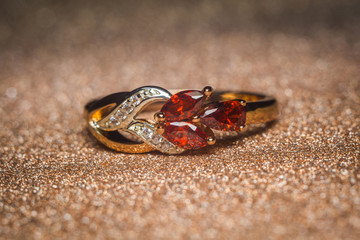 Gold ring with red stones