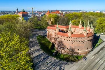 Zelfklevend Fotobehang Barbican (Barbakan) in Cracow, Poland. The best preserved medieval barbican in Europe and Planty park surrounding the old city. Aerial view © kilhan