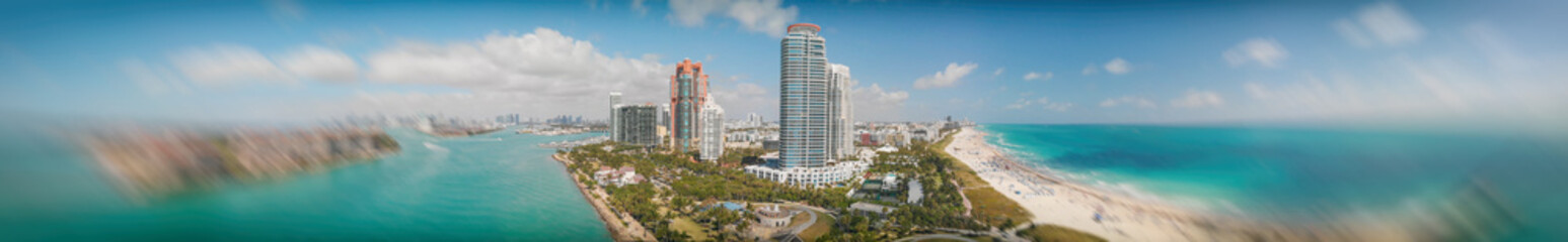 Panoramic aerial view of Miami Beach and South Pointe Park at dusk