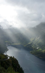 View of the Geiranger fjord from the observation deck, sunrise, overcast, Norway