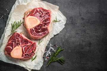 Raw beef steak osso bucco on black. Marble meat.