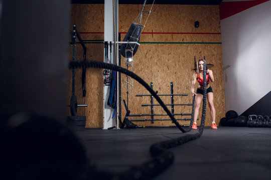 Photo of young athlete girl in training with two ropes