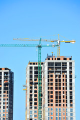 Fototapeta premium Crane and highrise construction site