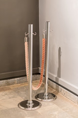 Mobile fence barrier with red belt and metal chrome pole posts for protection fence crowd