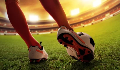 Gordijnen Soccer player kicking © fotokitas