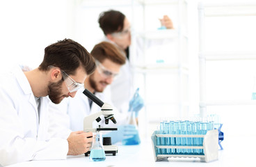 toned image.a group of scientists conduct research