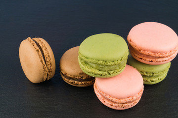 Delicious macaron on black background