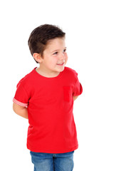 Funny small child with dark hair and black eyes crossing his arms