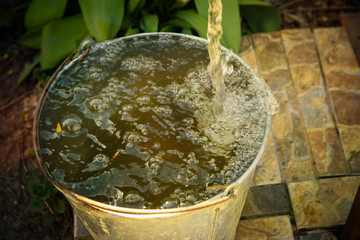 water flows into the bucket