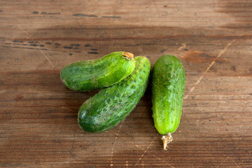 Cucumbers on a wooden background..