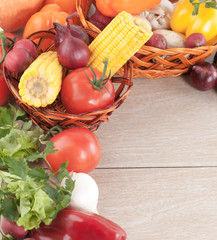 frame of fresh vegetables on a wooden background