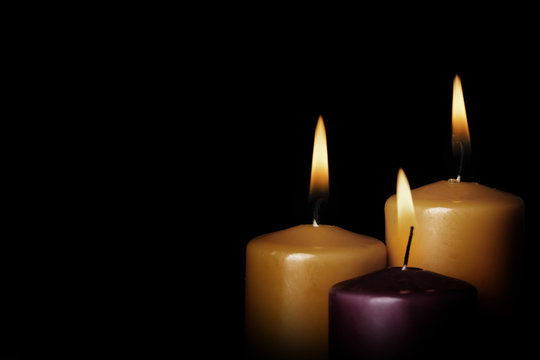 Candle light on the black background